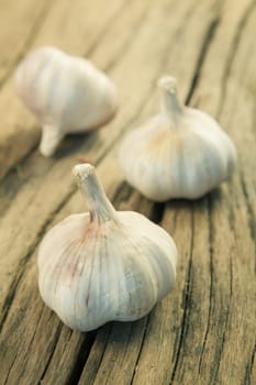 Organic garlic on the old wood backgound