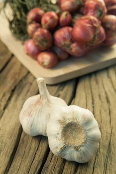 Organic garlic on the old wood background