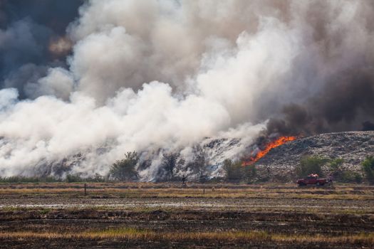 Burning garbage heap of smoke from a burning pile of garbage