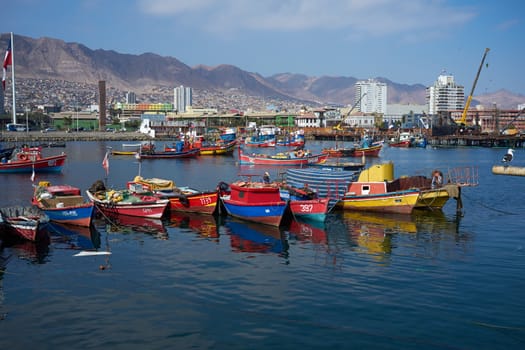 Colourful wooden fishing boats in the harbour at Antofagasta in the Atacama Region of Chile