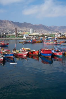 Colourful wooden fishing boats in the harbour at Antofagasta in the Atacama Region of Chile