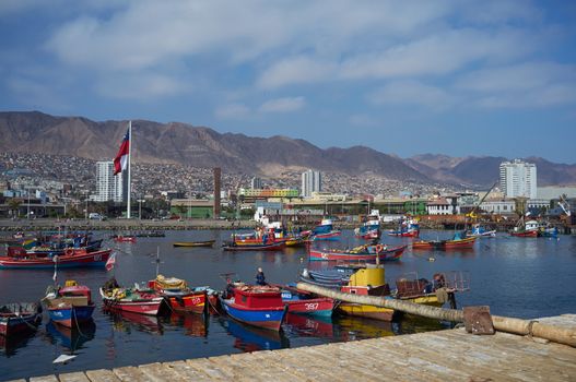 Colourful wooden fishing boats in the harbour at Antofagasta in the Atacama Region of Chile