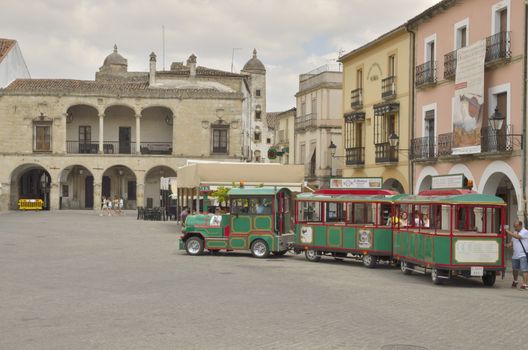 Tourist bus at the Main Square in Trujillo, a village of the province of Caceres, Extremadura, Spain.