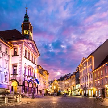 Romantic Ljubljana's city center, the capital of Slovenia, Europe. City hall and Roba's fountain shot at dusk.