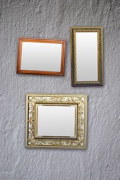 empty frames for photos hanging on the white wall