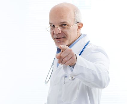 Doctor pointing at the camera and smiling.