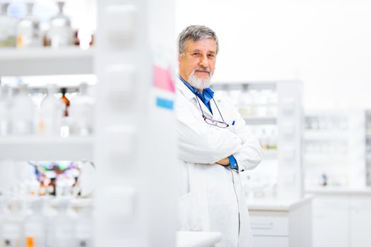 Senior male researcher carrying out scientific research in a lab (shallow DOF; color toned image)