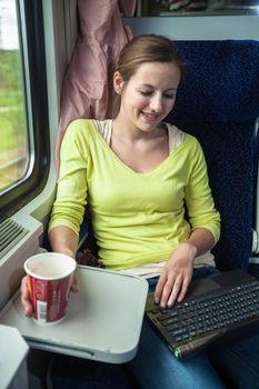 Young woman traveling by train