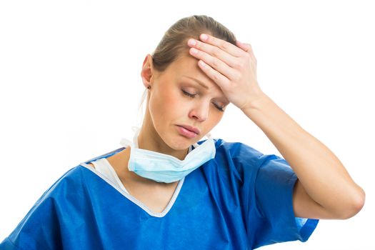 Portrait of a female doctor/surgeon feeling down, exhausted, frustrated, very tired, .... on white background