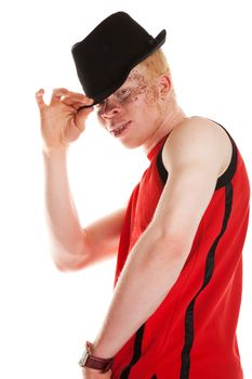 Portrait of an African albino man tipping his hat.