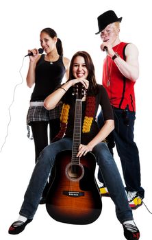 Two mixed race girls and an albino african guy in a musical trio.  Shot on white background.