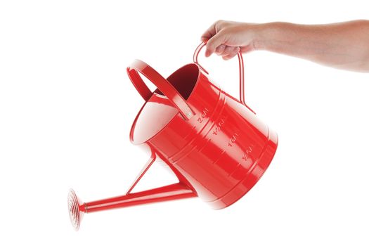 A man's hand with red watering can on white background.