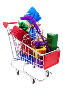 A cart full of wrapped Christmas presents, including a wrapped hockey stick and a wrapped bottle of wine.  Shot on white background.