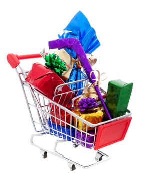 A cart full of wrapped Christmas presents, including a wrapped hockey stick and a wrapped bottle of wine.  Shot on white background.