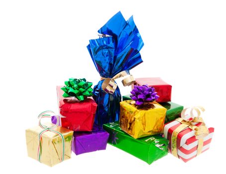 A stack of Christmas presents, including a wrapped bottle of wine.  Shot on white background.