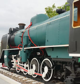 Ancient steam train placed on the tracks, displayed to the audience.                               