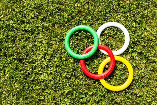 Plastic rings on the green grass background