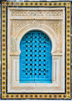 Traditional window with pattern and tiles from Sidi Bou Said in Tunisia