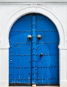 Blue gate and door with ornament from Sidi Bou Said in Tunisia