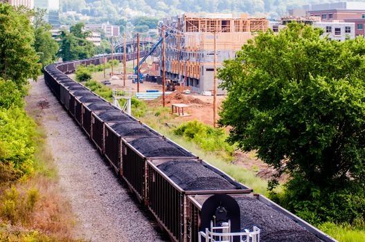 slow moving Coal wagons on railway tracks