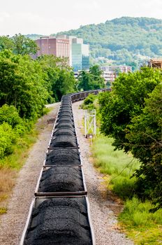 slow moving Coal wagons on railway tracks