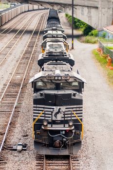 slow moving Coal wagons on railway tracks