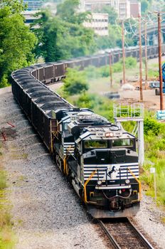 slow moving Coal wagons on railway tracks