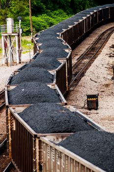 slow moving Coal wagons on railway tracks