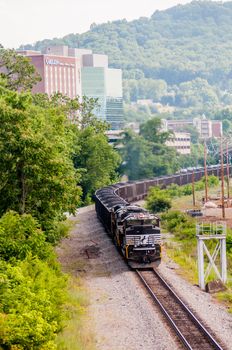 slow moving Coal wagons on railway tracks