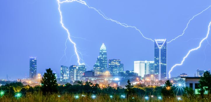 thunderstorm lightning strikes over charlotte city skyline in north carolina usa