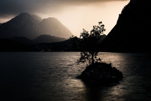 Small island on the lake in mountains Austria