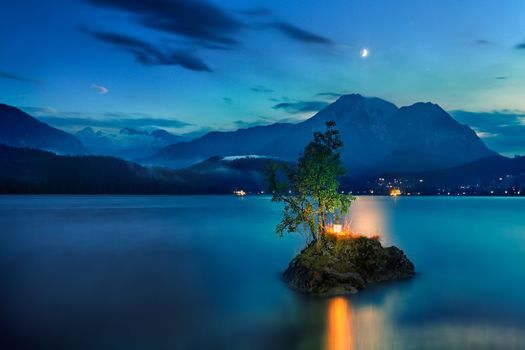 Small island on the lake in mountains Austria