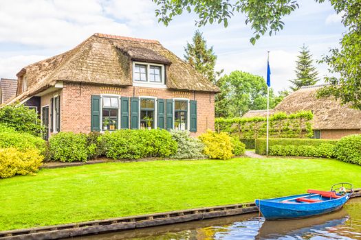 Typical Dutch houses and gardens in Giethoorn, The Netherlands