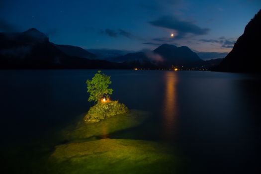 Small island on the lake in mountains Austria