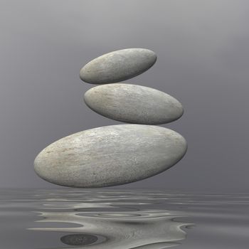 Three pebbles in balance upon water by grey day