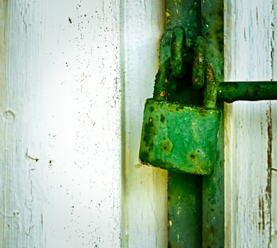 background with old green rusty iron padlock