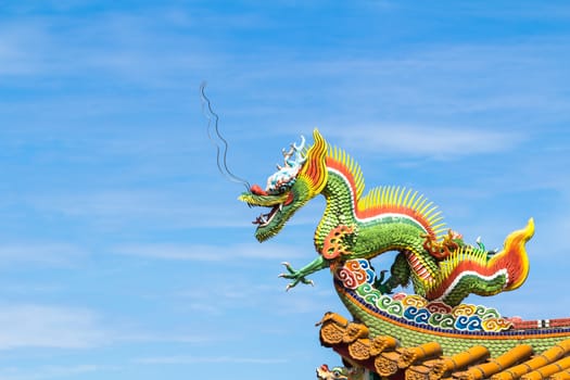 Dragon sculpture on roof of a Chinese temple.