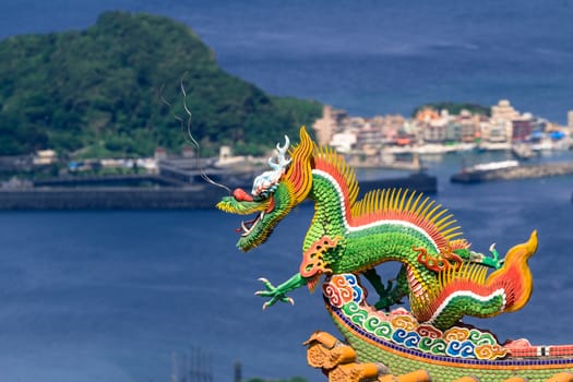 Dragon sculpture on roof of a Chinese temple.