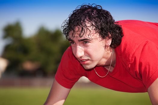 A young athlete imagines the finish line in his mind, as he gets ready to race.