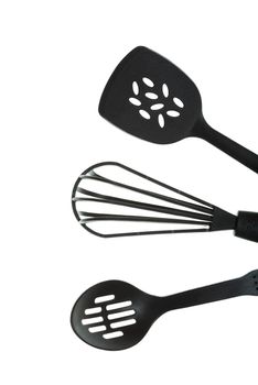 Black cooking utensils on a white background.