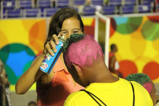 Entertainers getting their hair sprayed with glitter in preparation for entertaining at a carnaval in Rio de Janeiro, Brazil
02 Mar 2014
No model release
Editorial only