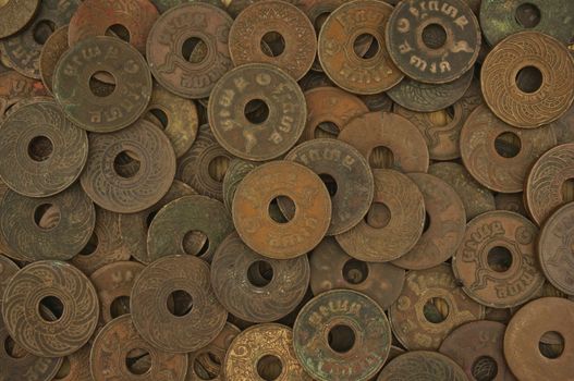 Pile of old ancient coins of Thailand as texture and background.