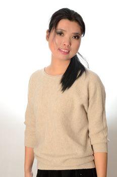 Asian woman wearing casual clothes. Chinese female model, friendly face expression.