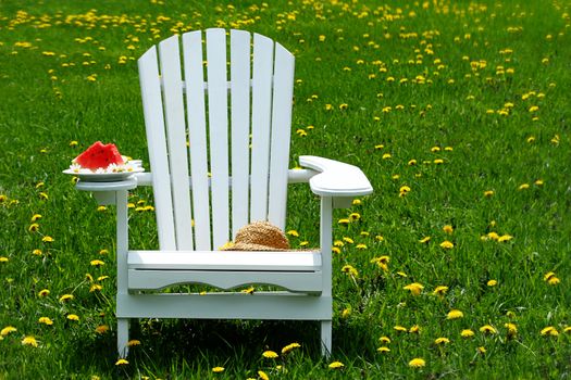 Slice of watermelon on adirondack chair