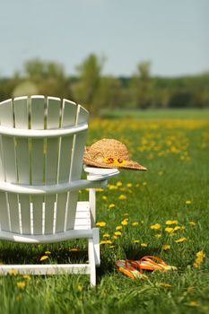 Adirondack chair with summer hat