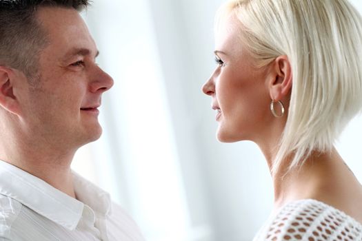 Love, family. Attractive couple at home