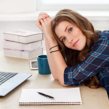 Student, office. Cute, beautiful woman by the table