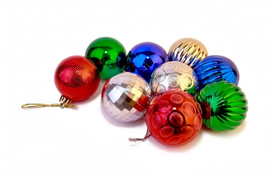 Several multi-colored Christmas balls isolated on white background