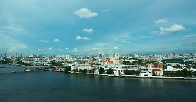 Scenery on the river in the capital of Thailand.
A beautiful blue sky and a wide river.                            