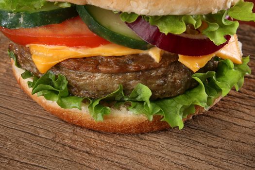 Close up of a tasty hamburger on wood background